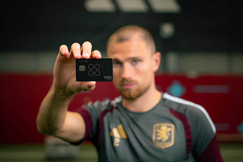 Matty Cash holding the Xapo Bank