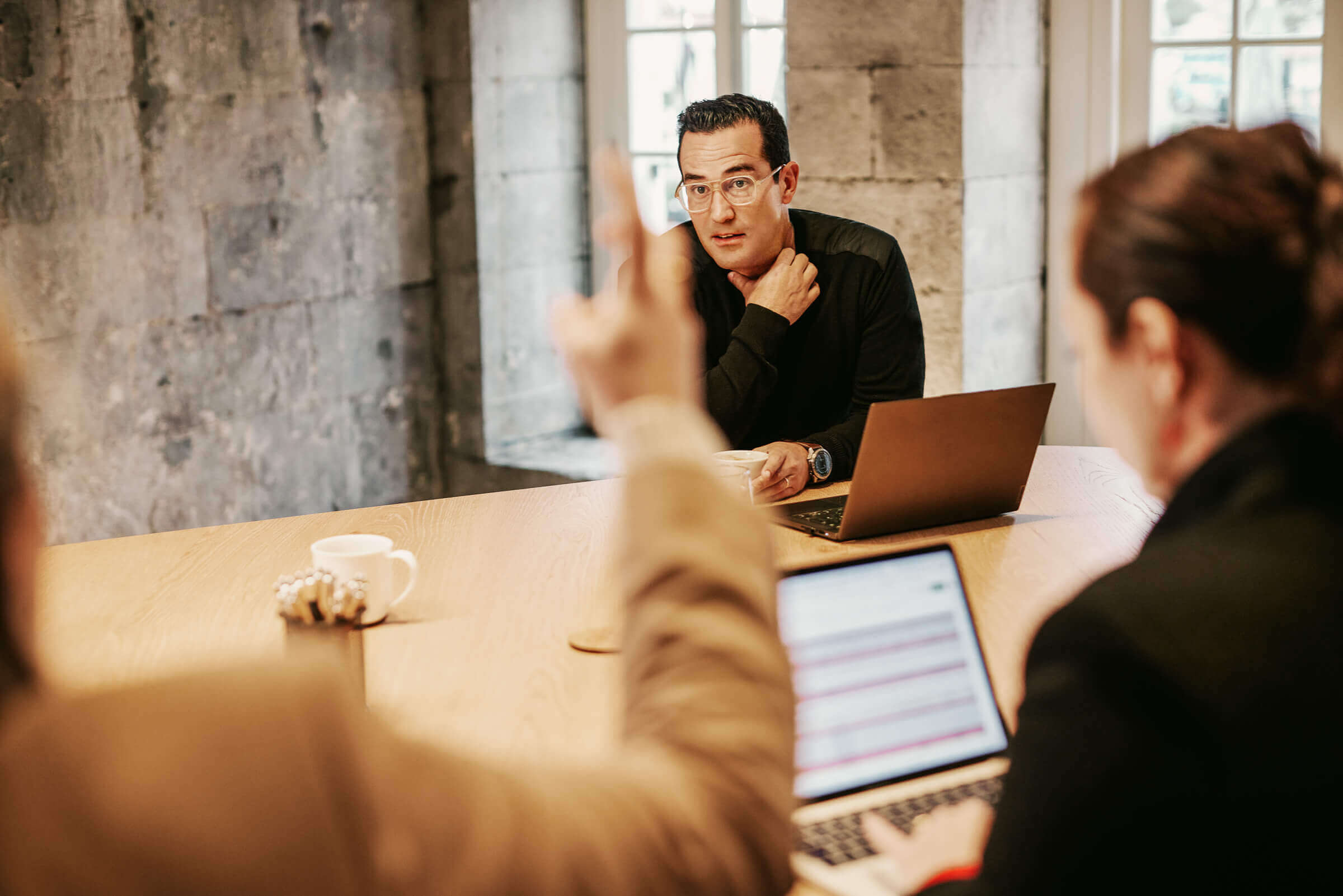 Xapo Bank employees in discussion at the Gibraltar headquarters.